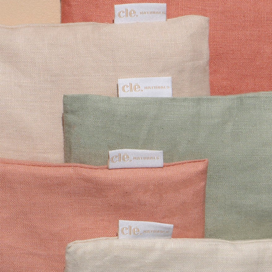 Five cle naturas aromatherpay eye pillows in various colours layered slightly on top of pne another in a line